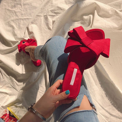 Wearing flat slippers women's shoes  Korean version of the summer new large bow satin round head sandals Wild half slippers