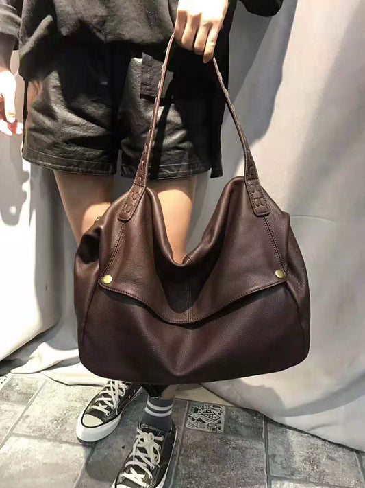 The New First Layer Cowhide Pandora Box Woven Bag is a One-Shoulder Cross-slung Bag for Women