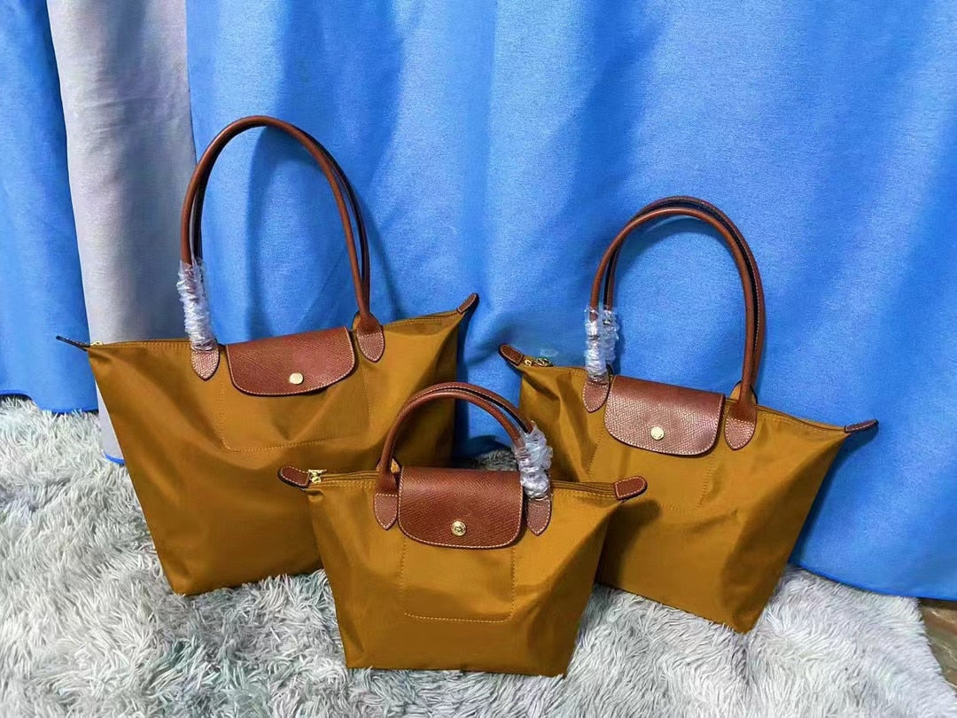 Autumn and winter new nylon cognac color dumpling bag women&#39;s  portable shoulder bag cowhide leather mummy bag